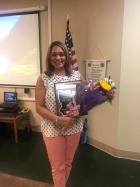 Avoyellean of the Year honoree Allison Ravarre-Augustine shortly after the presentation., with plaque and flowers form her husband in hand.
